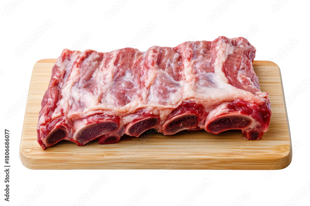 Obraz premium Fresh raw meat ribs displayed on a wooden cutting board. the marbling and texture. with a clean kitchen background emphasizing a culinary preparation scene