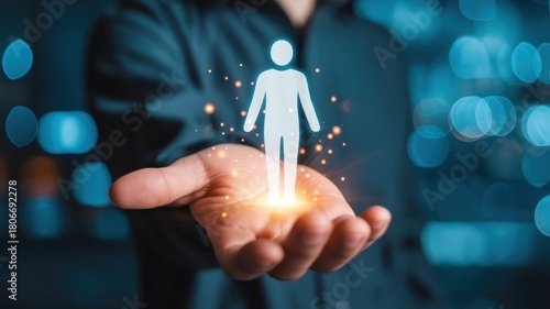 Human resource management concept visualized through a glowing silhouette held in an open palm
