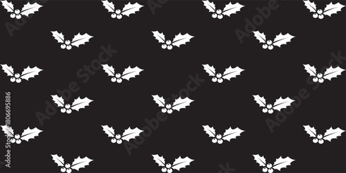 Pattern with motifs of holly leaves and small berries on a black background