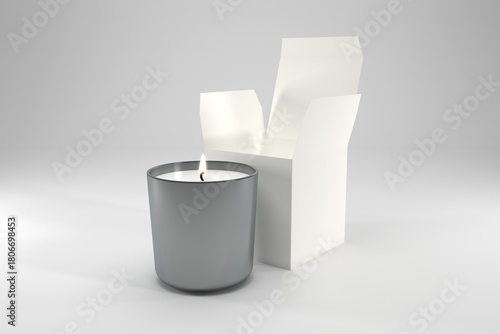 Elegant candle glowing beside its box, perfect for cozy home decor and relaxation in any room or personal space
