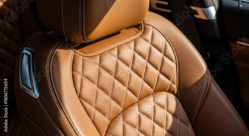 Luxurious tan leather car seat with elegant stitching and premium interior craftsmanship.