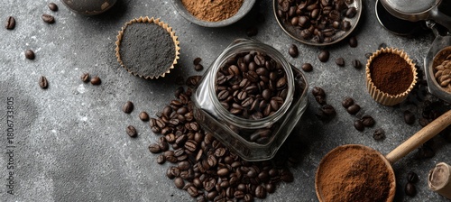 Coffee beans in a jar and ground coffee on a gray background.