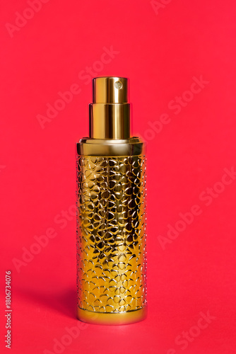 Perfume on red background