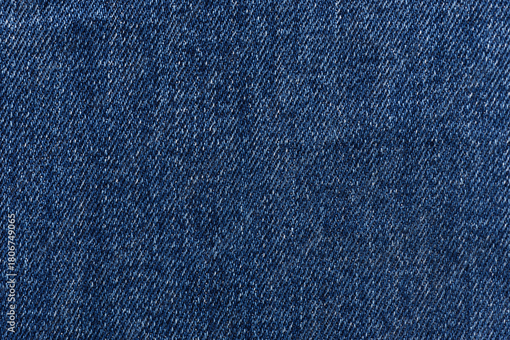 Naklejka premium Washed denim fabric texture background