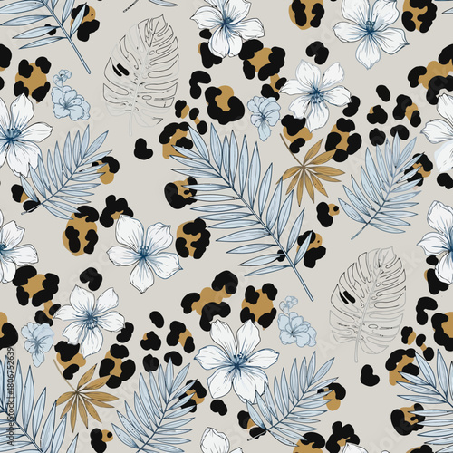 Seamless pattern with leopard spots, tropical leaves, and flowers perfect for textile design, wallpaper, and other creative projects a trendy and stylish design