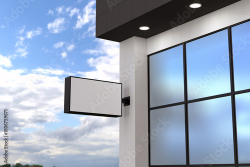 Promote your brand with a modern sign mock-up outside a building against a bright sky for maximum impact
