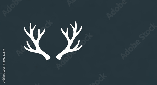 A minimalist illustration featuring a pair of white deer antlers against a dark blue background, creating a simple yet striking visual with a winter or nature theme