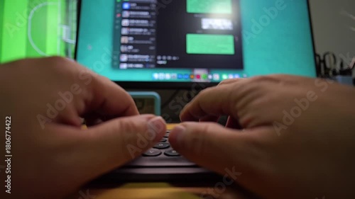 A person's hands are typing on a laptop keyboard, engaged in a chat conversation displayed on the blurred computer screen.