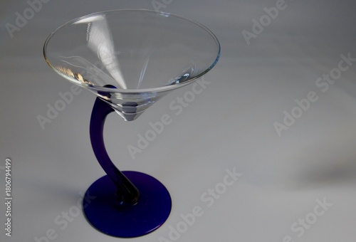 an empty blue stemmed Martini glass