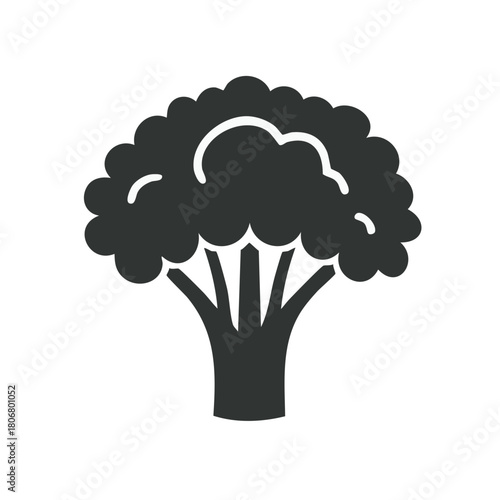 Dark broccoli floret silhouette against light background for healthy cooking themes