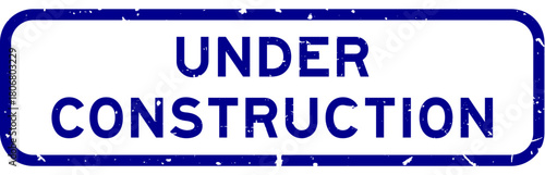 Grunge blue under construction word square rubber seal stamp on white background