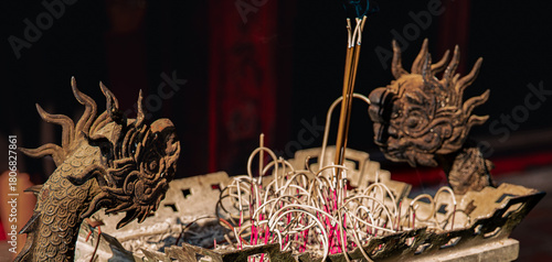 Incense Sticks in Dragon-Embellished Pot at the Temple of Literature, Hanoi, Vietnam