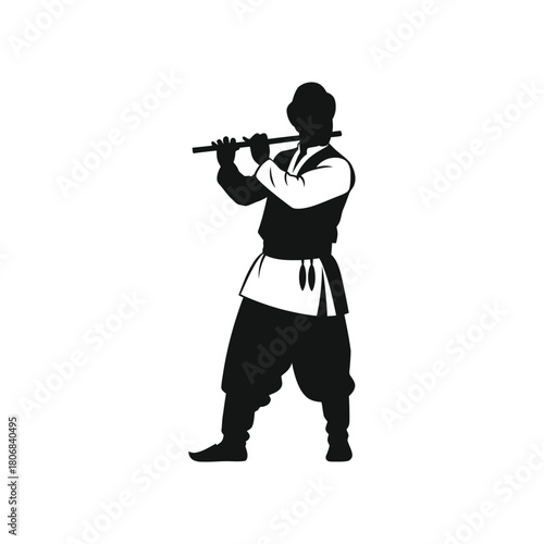 Silhouette of a man playing a flute in traditional attire