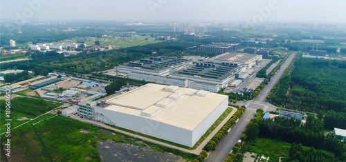 Aerial view of white factory buildings