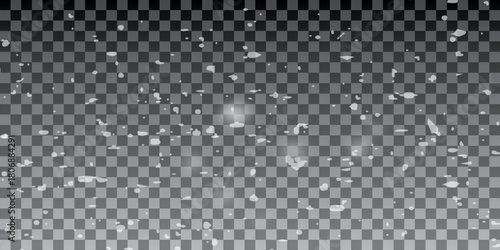 Real snowfall over black background. Abstract snowy white particles falling for winter weather overlay or cold snowfall background. Heavy snow storm.