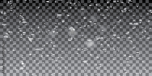 Real snowfall over black background. Abstract snowy white particles falling for winter weather overlay or cold snowfall background. Heavy snow storm.
