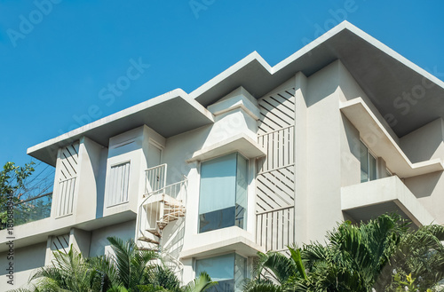Modern design white houses under blue sky. Residential building area