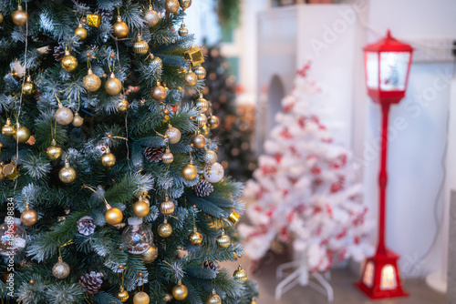 Merry x-mas,Close up of Colorful balls ,gifts box and Christmas greeting picture parcel,bell decoration on Green Christmas tree background Decoration During Christmas and New Year.