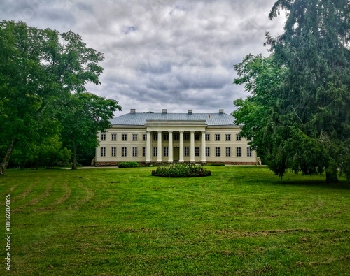 Wallpaper Mural Cirkliskis Manor, located in Lithuania, features a neoclassical architectural style with a prominent portico supported by four large columns. The two-story building has a symmetrical facade Torontodigital.ca