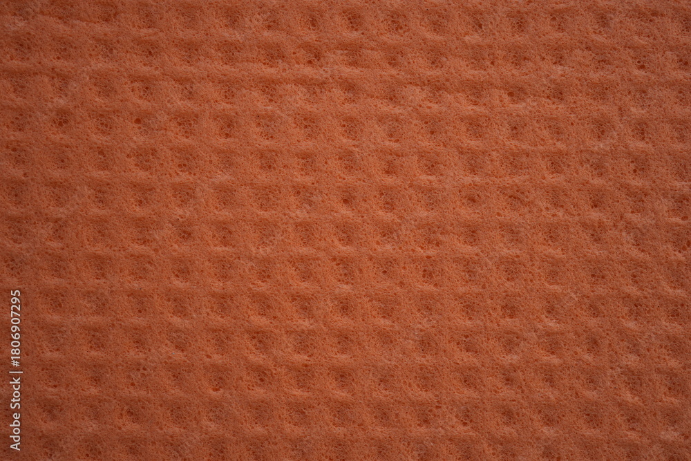Fototapeta premium orange sponge texture close up, pink abstract sponge texture as background photo on top
