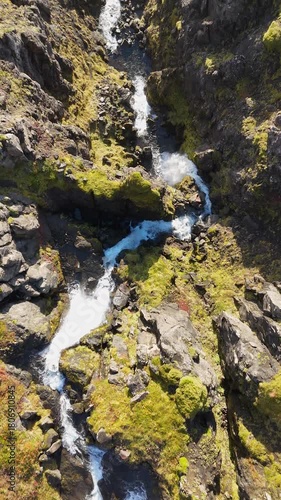 Aerial view of a waterfall on the Snaefellsnes peninsula in Iceland - vertical 4K video