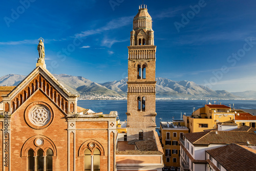 Fototapeta Naklejka Na Ścianę i Meble -  Gaeta, Latina, Lazio, Italy. A splendid view of the city. The old town with its houses overlooking the sea. The Cathedral of Saints Erasmo and Marciano and Santa Maria Assunta with its bell tower.