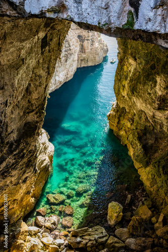 Gaeta, Latina, Lazio, Italy. A splendid view of the city. The ancient village with its houses overlooking the sea. The spectacular Grotta del Turco on the Montagna Spaccata (Split Mountain) cliff.