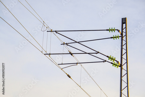 Railway Overhead Catenary System: High Voltage Power Lines and Insulators on a Metal Mast