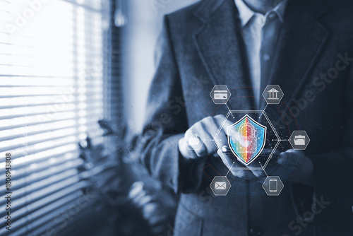 Businessman using smartphone with virtual shield icon. Cyber security concept. Data protection, privacy technology, safe mobile banking, internet safety and secure digital payment.