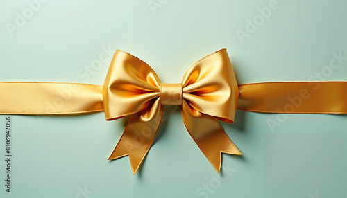 Golden ribbon bow on white background, elegant festive decoration