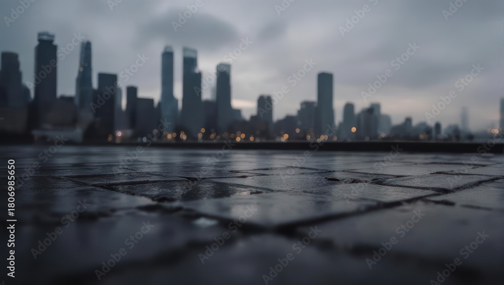 Obraz premium Cityscape Reflection on Wet Pavement Under Overcast Sky.