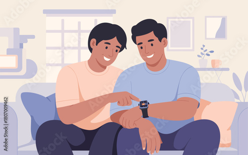 Young couple looking at smartwatch together on couch