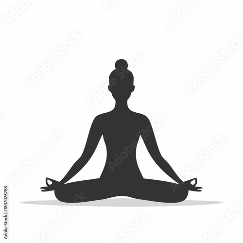 Black silhouette of a woman sitting in a lotus yoga pose for meditation and relaxation on a white background.