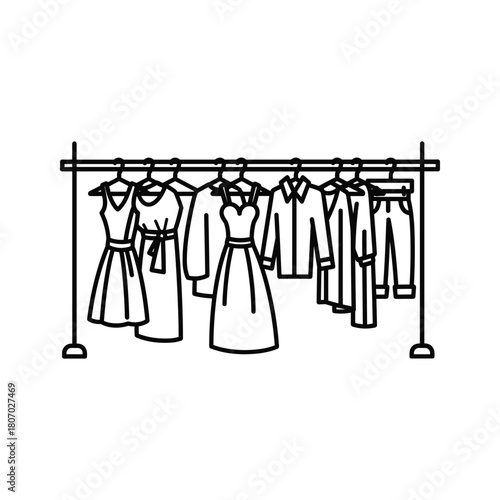 Clothing rack with various garments hanging on hangers, isolated on