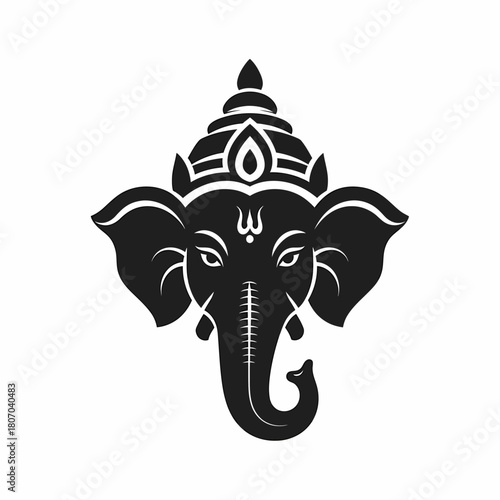 A stylized black and white illustration of the Hindu deity Ganesha's head, featuring intricate details.