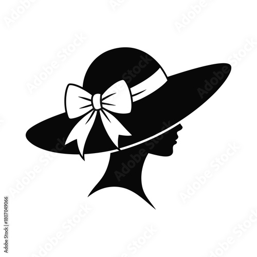 Elegant silhouette of a woman wearing a wide brimmed hat
