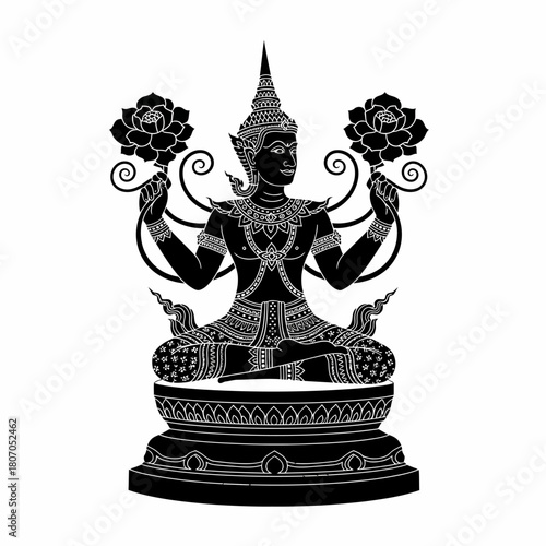 Intricate black silhouette of a seated Thai deity in traditional costume holding two lotus blossoms.