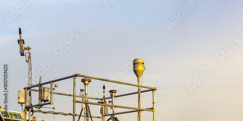 Urban Air Quality Monitoring Station with Weather Sensors on Metal Gantry