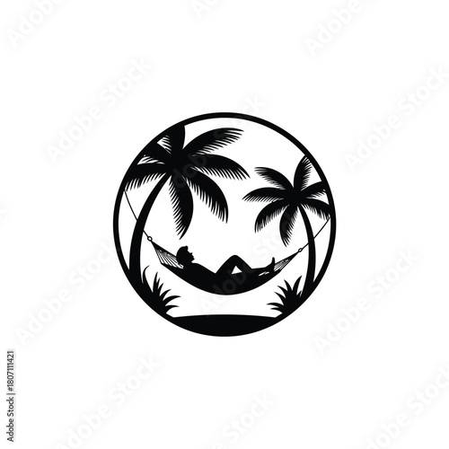 Silhouette of person relaxing in a hammock between palm trees