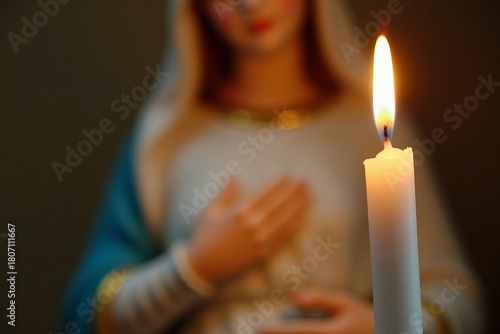 A Candle Illuminating the Statue of the Virgin Mary: A Symbol of the Feast of the Immaculate Conception