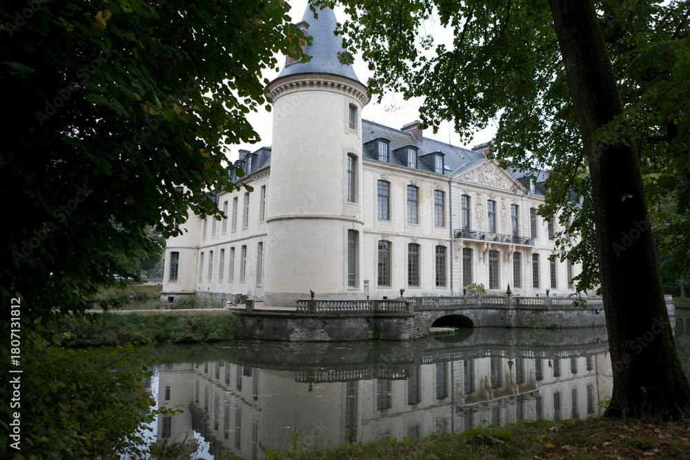 Fototapeta premium France's Chantilly Castle on a cloudy summer day