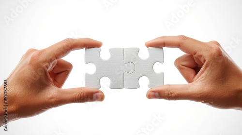 Hands Connecting Two White Puzzle Pieces