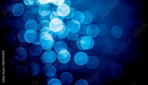 Abstract bokeh background with blue circles, perfect for digital art, wallpapers, and elegant designs