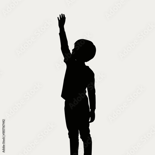 Silhouette of a young child reaching upwards with one arm.