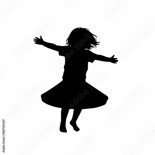 Silhouette of a joyful girl with arms outstretched, dancing and twirling in the air.
