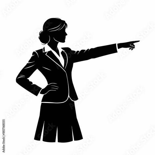 Confident businesswoman pointing forward with determination and purpose in her gaze.