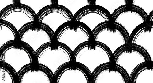 A seamless black and white pattern of hand-painted arches with a brushstroke texture, resembling fish scales.
