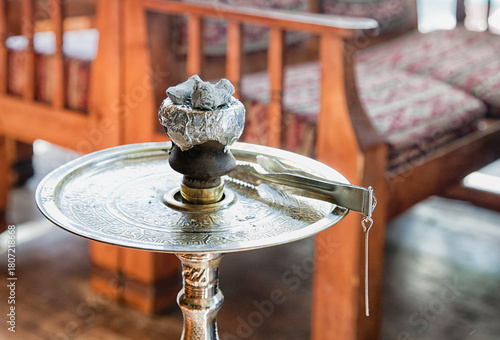 High angle close up of a hookah pipe on a metal table, Turkey.