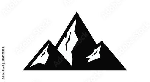 Majestic mountain peaks silhouetted against a bright sky, symbolizing adventure and aspiration.