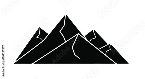 Majestic mountain range silhouette against a bright, clear sky